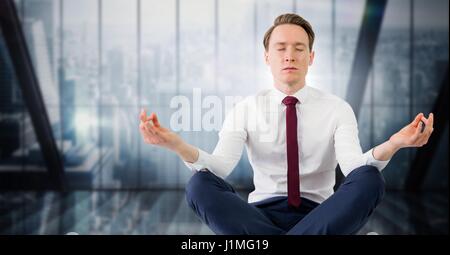 Digital composite of business man meditating contre fenêtre floue bleu foncé Banque D'Images