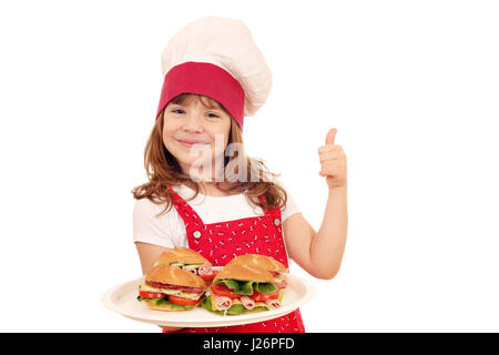 Happy little girl cook avec sandwiches et thumb up Banque D'Images