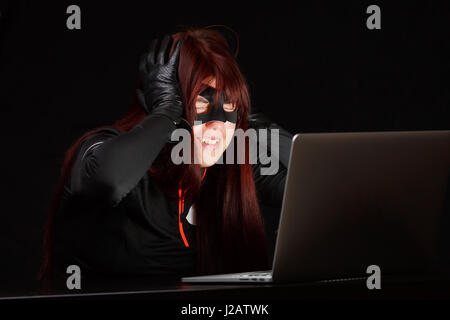 Happy hacker dans black mask Banque D'Images