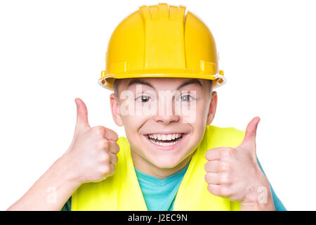 Boy wearing hard hat jaune Banque D'Images