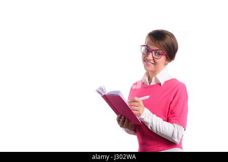 Business Woman in pink écrit dans un journal intime Banque D'Images