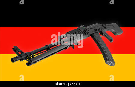 - Un gros plan d'armes d'assaut noir à l'Allemagne d'un drapeau de fond. Banque D'Images