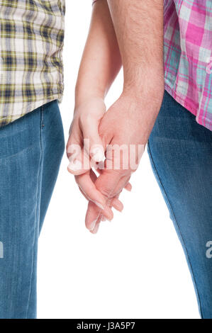 Close-up of lovers tenant la main comme concept de fixation sur fond blanc Banque D'Images