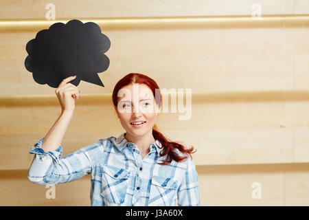 Red-haired Woman with Speech Bubble Sign Banque D'Images