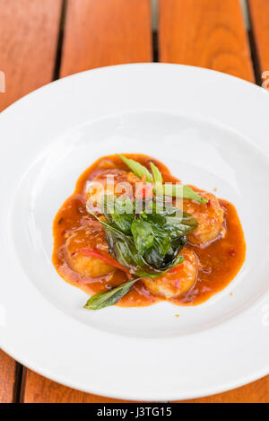 Palourdes sautées avec pâte de piment Banque D'Images