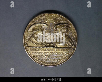 Ce portrait représente Louis II de Hongrie et Marie de Habsbourg. Louis II, roi de Hongrie et de Bohême, est représenté aux côtés de sa femme, membre de la puissante dynastie des Habsbourg. Leur union a été politiquement significative dans le renforcement des liens entre les Habsbourg et le Royaume de Hongrie. Banque D'Images