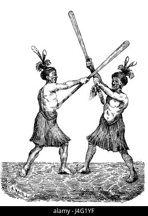 Le Taiaha est une arme maorie traditionnelle de Nouvelle-Zélande. La position décrite fait référence à la position spécifique utilisée lors des combats ou des cérémonies, incarnant la culture guerrière maorie. Banque D'Images