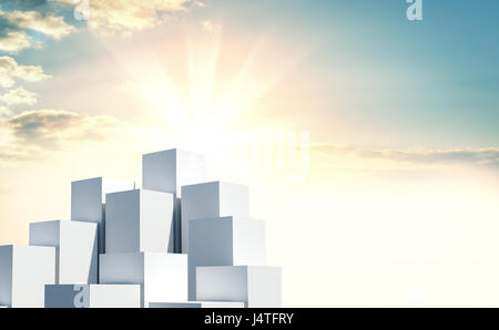 Une pile de cubes contre un beau lever de soleil Banque D'Images