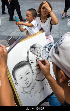 Artiste de rue chinois un dessin portrait, Yinchuan, Ningxia, Chine Banque D'Images