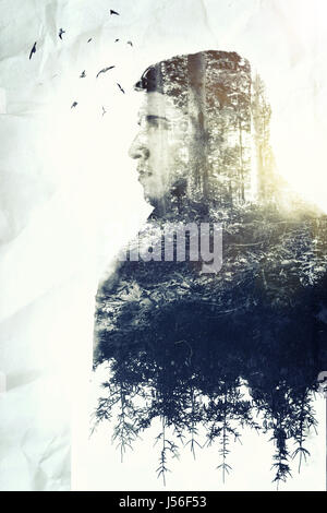 Double exposition de jeune homme sérieux qui aime la nature Banque D'Images