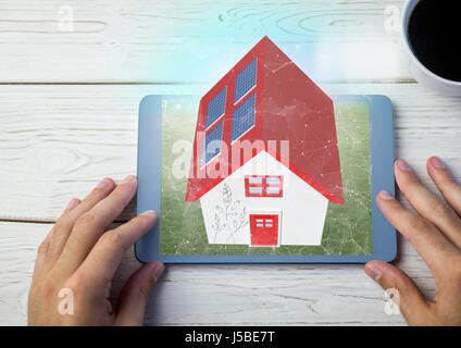 Digital composite de red roof house sur tablette. avec table Banque D'Images