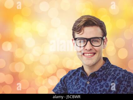 Digital composite of Portrait of handsome man smiling over bokeh Banque D'Images