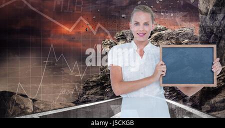 Digital composite of Confident businesswoman holding slate Banque D'Images
