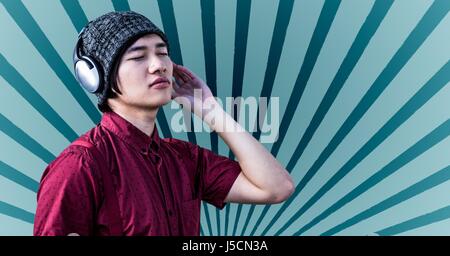 Digital composite de Hipster listening to music on headphones Banque D'Images