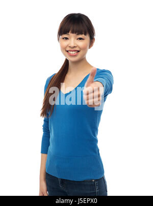 Happy smiling young woman showing Thumbs up Banque D'Images