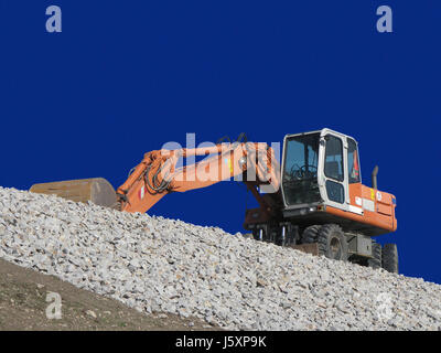 Pelle de gravier bleu construction machine construction bleu site d'entraînement du moteur de roue Banque D'Images