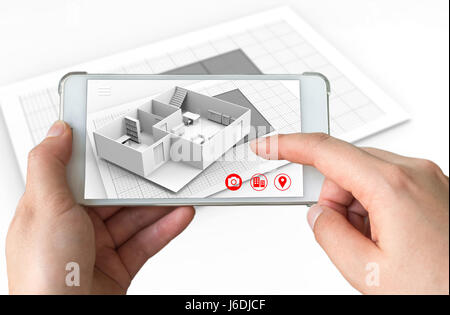 Concept de marketing de la réalité augmentée pour l'architecture. Hand holding smart phone avec AR pour simuler l'application popup 3d pièce interactive maps à la vie Banque D'Images