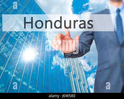 Honduras - Businessman hand appui bouton sur l'interface de l'écran tactile. Le commerce, la technologie, internet concept. Stock Photo Banque D'Images