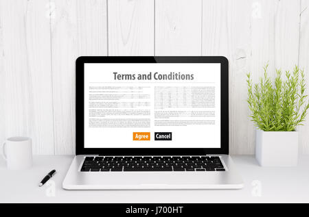 Le rendu 3D d'un ordinateur portable avec écran Termes et conditions sur la table Banque D'Images