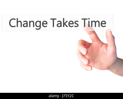Le changement nécessite du temps - part en appuyant sur un bouton sur l'arrière-plan flou concept . Le commerce, la technologie, internet concept. Stock Photo Banque D'Images