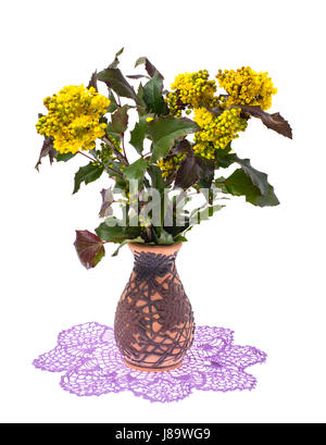 Vase avec des fleurs sur une serviette à la main Banque D'Images