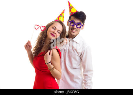 Jeune couple avec des bâtons et des chapeaux célèbre carte Banque D'Images