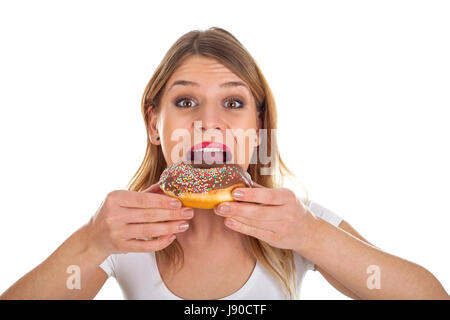 Photo d'une jeune femme de manger un délicieux donut Banque D'Images