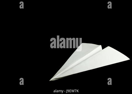 Avion de Papier blanc sur fond noir Banque D'Images