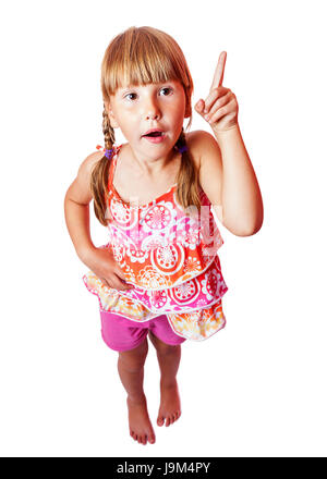 Sept ans Happy smiling girl pointing up isolated Banque D'Images