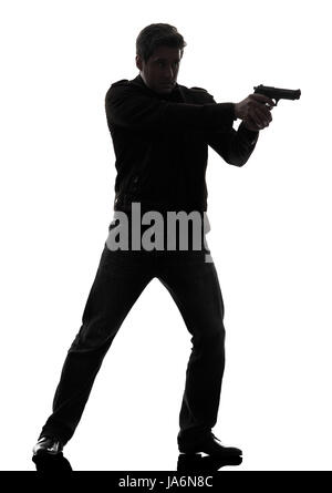 Un homme policier tueur fusil visant l'article studio silhouette fond blanc Banque D'Images
