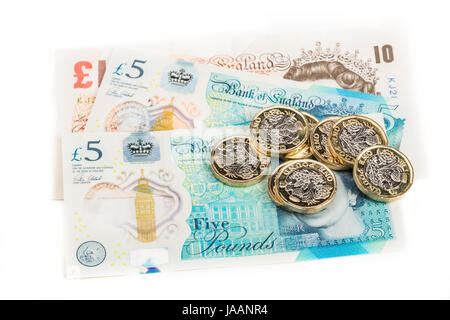 Une livre britannique de pièces sur les billets de banque britannique Banque D'Images