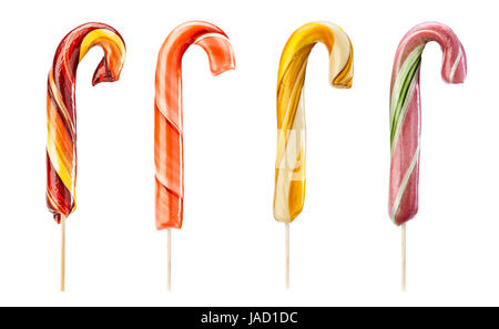 Ensemble de bonbons au caramel faisait tourner sur des bâtons, des couleurs différentes. Inclut le chemin de détourage Banque D'Images