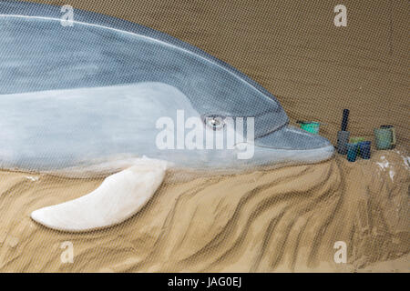 Sculpture sur sable des dauphins à la plage de Weymouth, Dorset, Royaume-Uni, en juin Banque D'Images