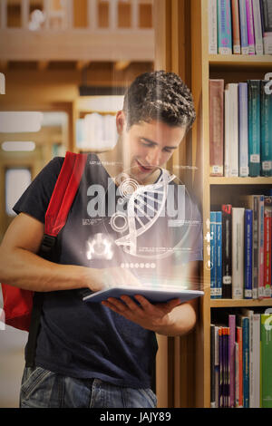 Handsome student working on her digital tablet in university library Banque D'Images