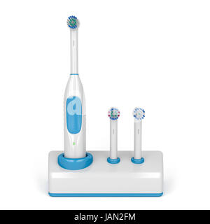 Brosse à dents électrique sur le stand avec deux balais de rechange Banque D'Images