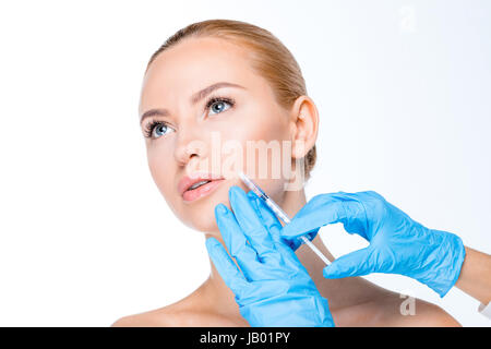 Portrait of woman getting botox injection on white Banque D'Images