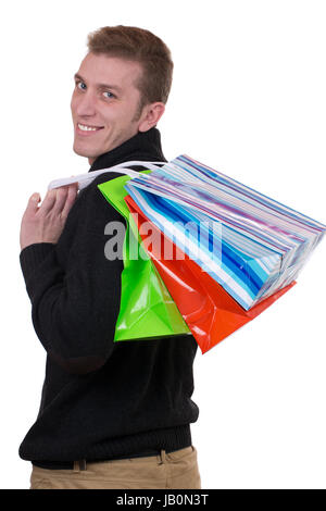 Ein junger Mann beim Shopping mit, Einkaufstaschen isoliert vor einem weissen Hintergrund Banque D'Images