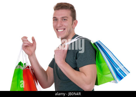 Ein junger Mann beim Shopping mit, Einkaufstüten isoliert vor einem weissen Hintergrund Banque D'Images
