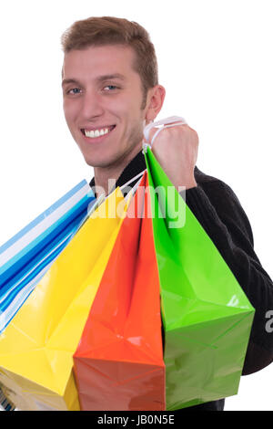 Lachender Ein Mann beim Einkaufen mit vor einem isoliert, Einkaufstaschen weissen Hintergrund Banque D'Images