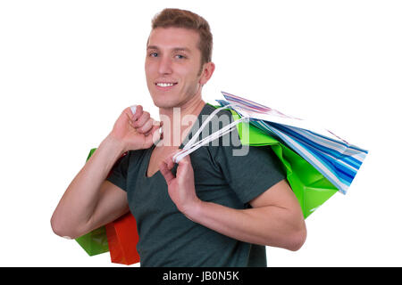 Ein junger Mann beim Einkauf mit Taschen, isoliert vor einem weissen Hintergrund Banque D'Images