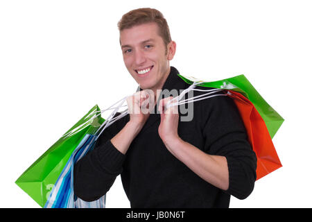 Ein junger Mann beim Shoppen Einkaufen und vor einem weissen, isoliert Hintergrund Banque D'Images
