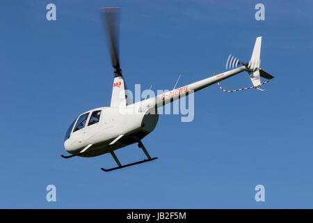 Robinson R44 Raven II G-MENU Banque D'Images