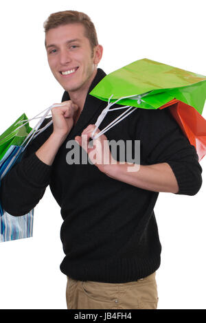Ein junger Mann beim Einkaufen mit vor einem isoliert, Einkaufstaschen weissen Hintergrund Banque D'Images