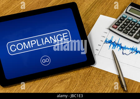 Mot de conformité sur tablette numérique avec la calculatrice graphique et financières Banque D'Images