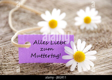 Une étiquette violette avec les mots allemand Alles Liebe zum Muttertag qui signifie joyeux Jour de mères Banque D'Images