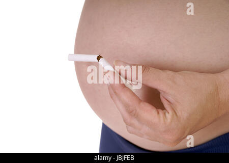 Femme enceinte avec une cigarette brisée Banque D'Images