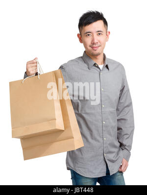 Handsome man holding Shopping bag Banque D'Images