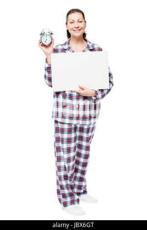 Brunette girl in pajamas holding une affiche et montrant réveil business concept Banque D'Images