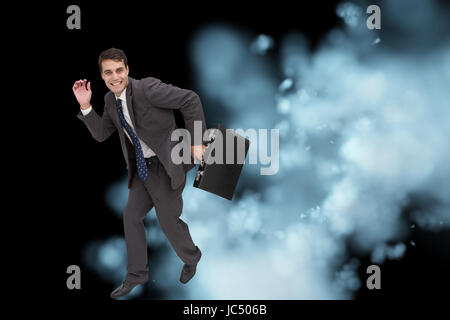 Composite image of attractive businessman dans un hury Banque D'Images