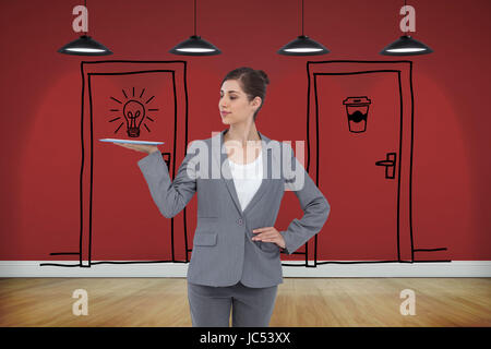 Composite image of businesswoman holding tablet computer Banque D'Images